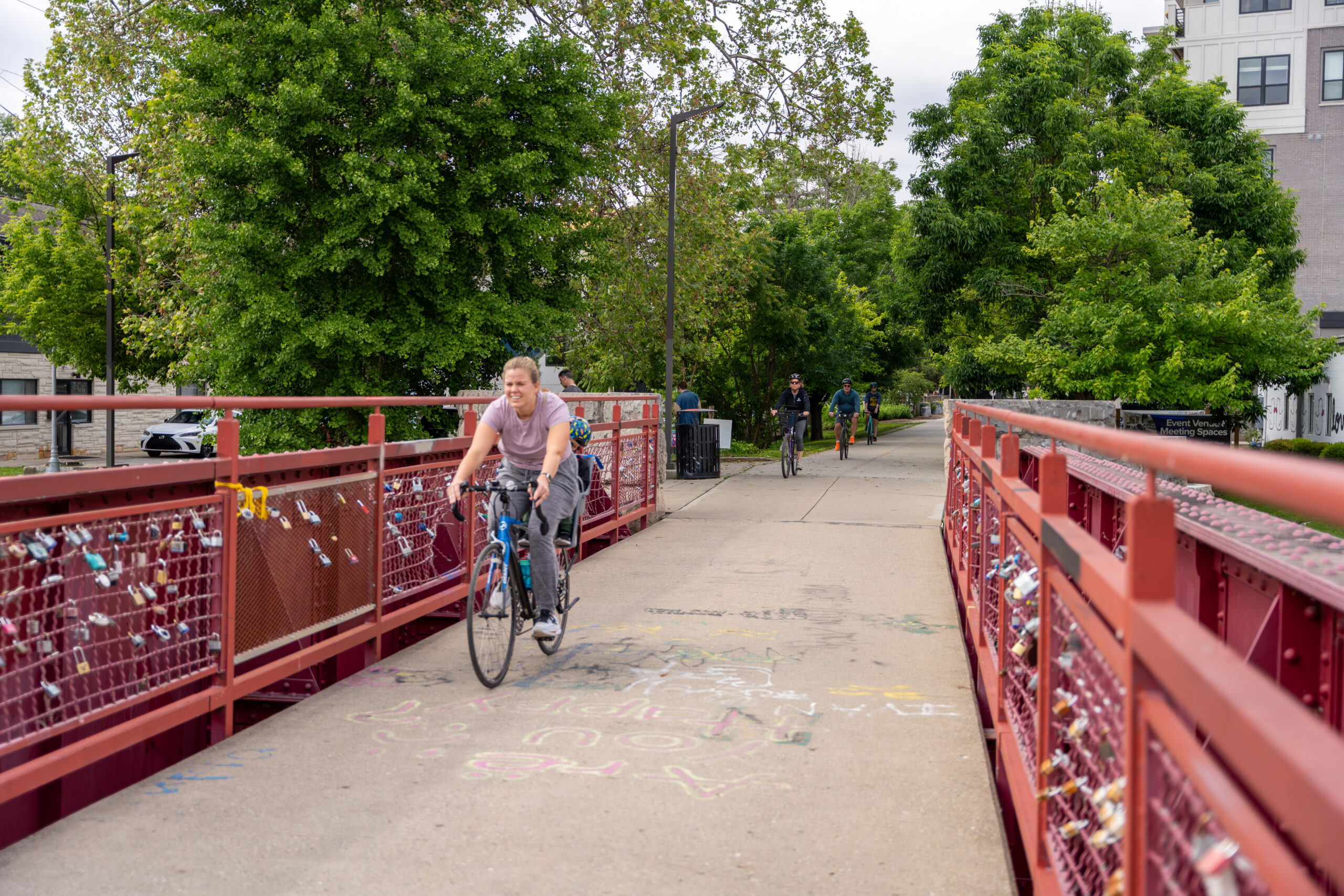 Picture of a someone riding a bicycle on the Monon Trail in Broad Ripple