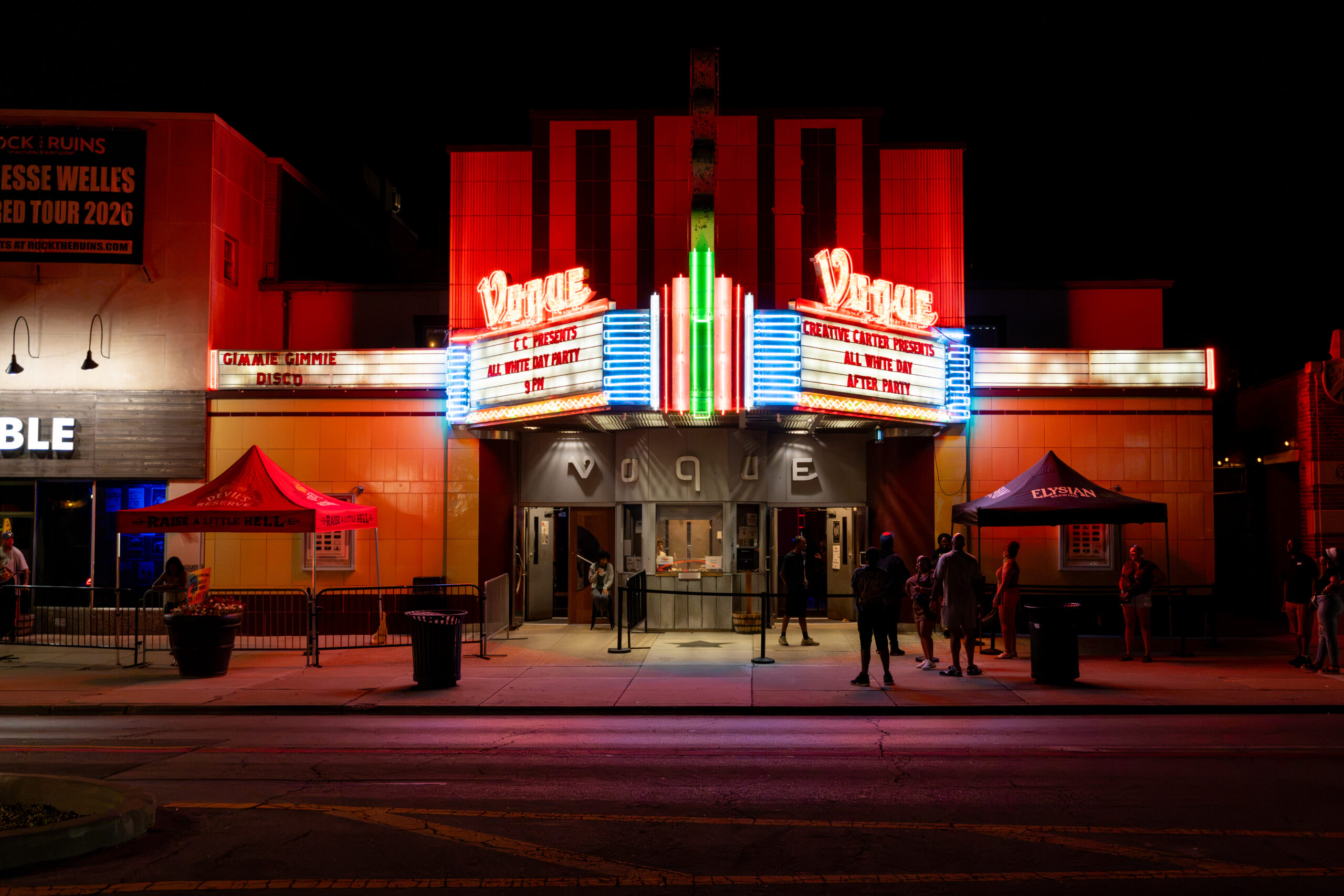 Picture of both sides of the Vogue sign in Broad Ripple at night