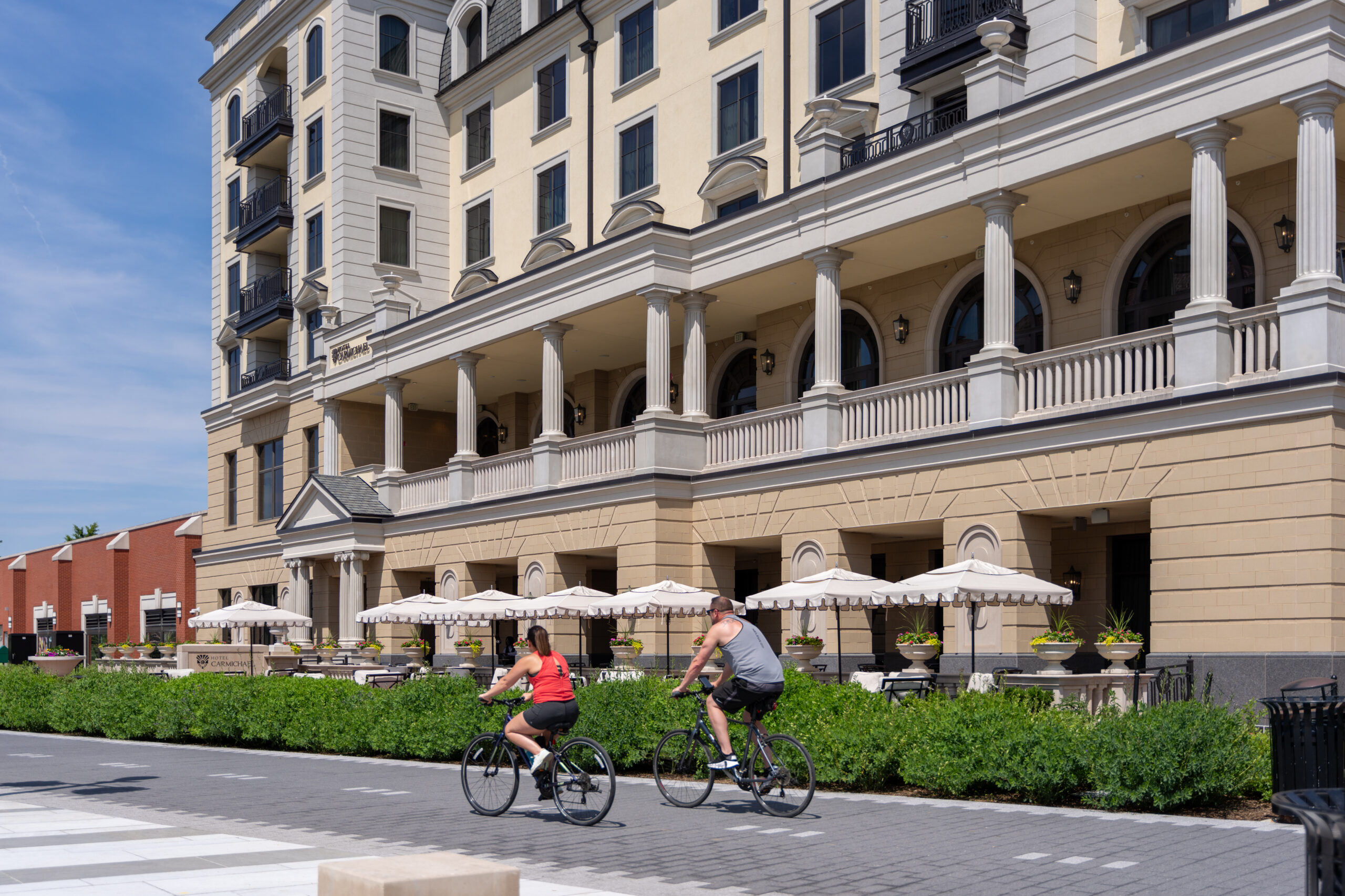 Two people riding bicycles in public in Carmel, Indiana