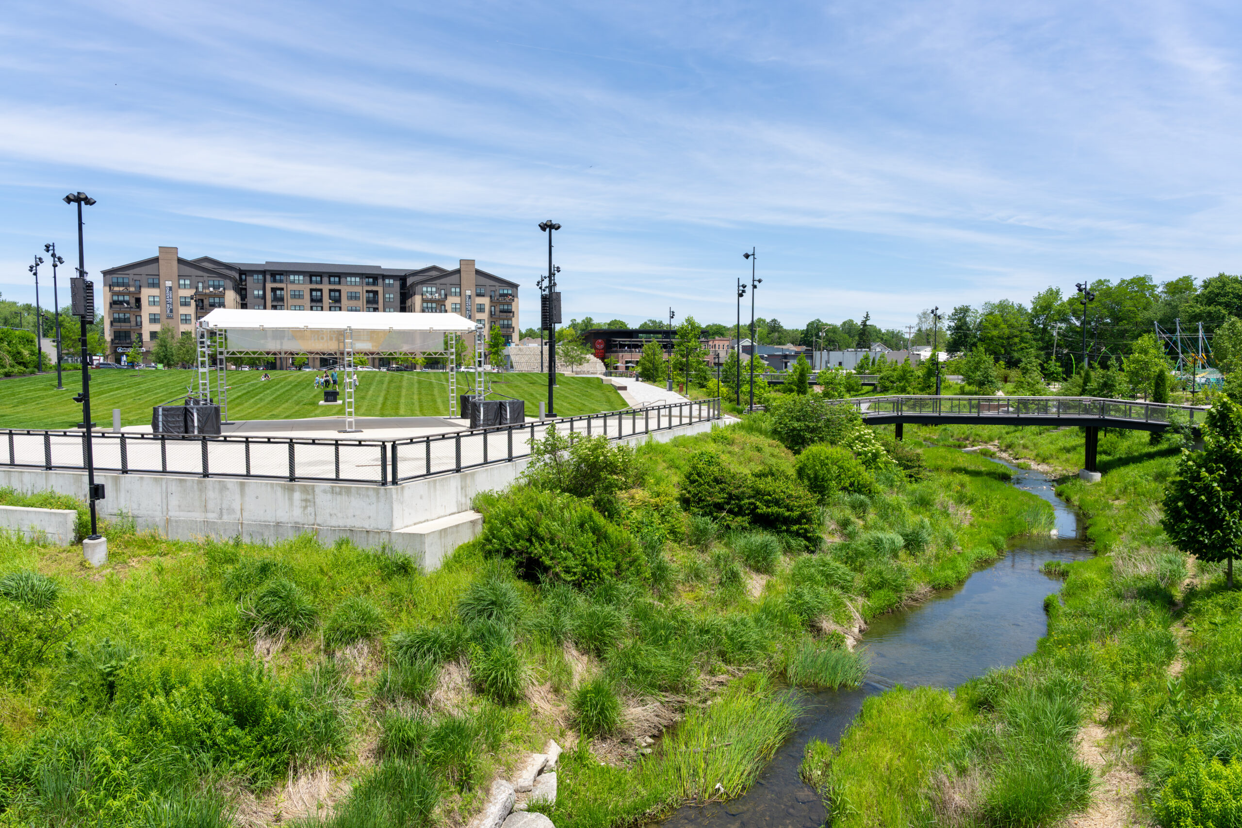 Photo across Grassy Branch Creek toward the Great Lawn at the Grand Junction Plaza in Westfield, Indiana