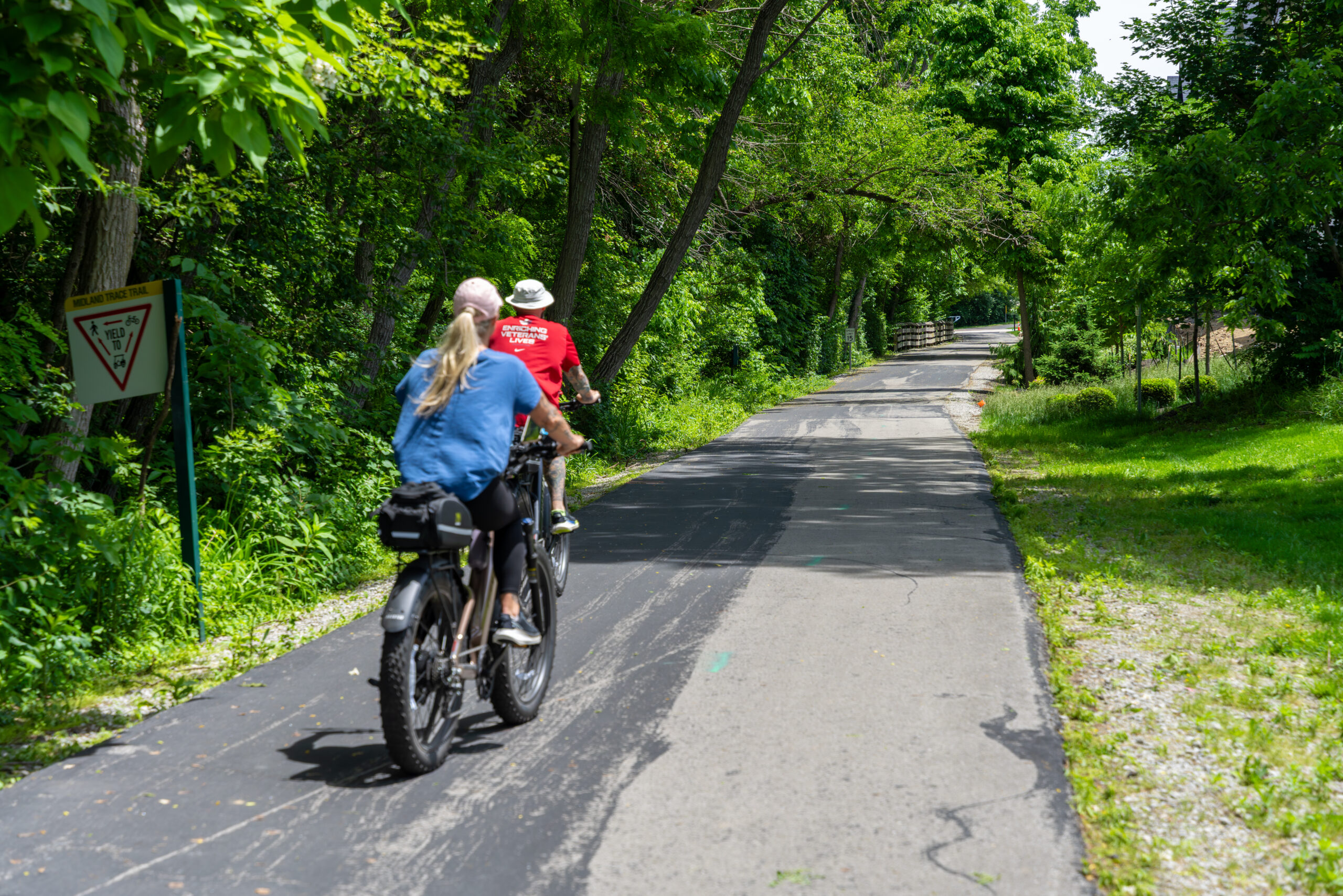 Two people riding bicycles on the Midland Trace Trail in Westfield, Indiana