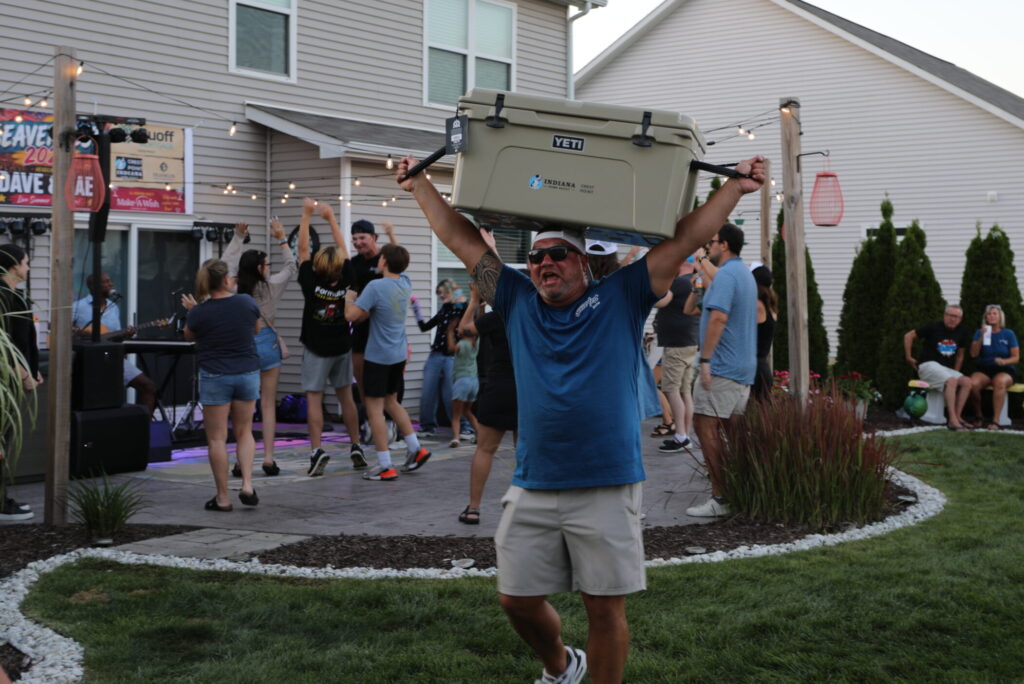 Seaverfest YETI Cooler Raffle Prize lifted above head